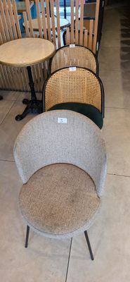 several chairs and tables are lined up in a row in a store