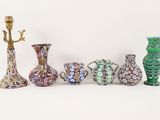 five vases that are sitting next to each other on a table
