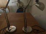 two lamps that are on top of a wooden table