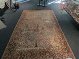 a rug on the floor in a store with a pair of shoes next to it