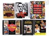 quatre livres exposés sur une surface blanche