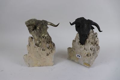 two sculptures of animals that are sitting on top of each other