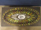 a picture of a stained glass table with a clock on it