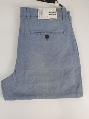 a close up of a pair of blue pants on a white surface