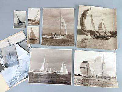 many pictures of sailboats in the water on the table
