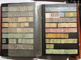 an open book with stamps on it on a table