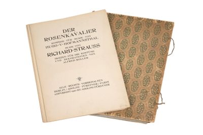 deux livres posés l'un sur l'autre sur une surface blanche