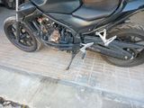 a black motorcycle parked on the side of the street