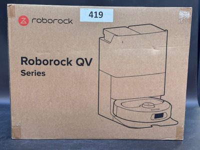 the box of a coffee maker is sitting on the table