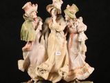 a figurine of a group of people on a black background