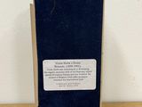 the back of a box with a label on it sitting on a wooden table