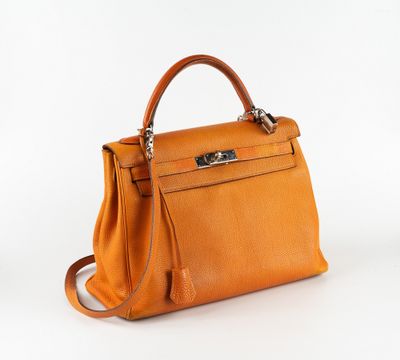sac à main Hermès en cuir orange avec des finitions argentées