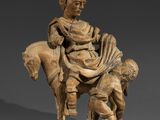 une image représentant une statue d'un homme à cheval accompagné d'un chien