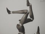 a black and white photo of a man doing a handstand