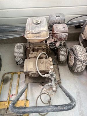 an image of a lawn mower sitting in a garage