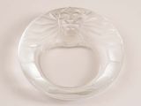 an image of a clear glass ring with a face on it