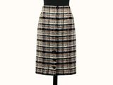 a black and white plaid skirt on a mannequin mannequin