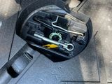 a car that has tools in the trunk of it