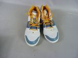 pair of white and blue sneakers with yellow laces on them