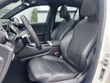 the interior of a car with black leather seats and a center console