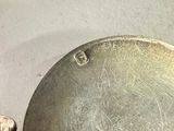 a lot of silver objects that are on a table
