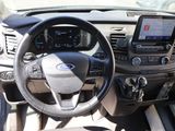 steering wheel and dashboard of a car with a tablet on the dashboard
