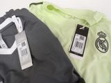 two men ' s polo shirts with a price tag on them
