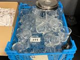 bottles of water are in a plastic container on a table