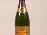 a bottle of champagne that is sitting on a table