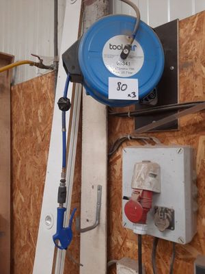 a picture of a blue hose is hanging on a wall