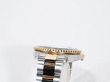 a close up of a watch on a white surface