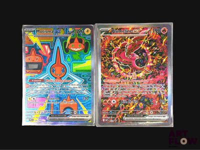 two pokemon cards are sitting side by side on a black surface