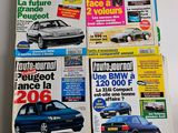 four magazines of different cars are stacked on top of each other