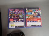 two video games on the table next to each other
