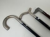 three different types of canes on a white surface