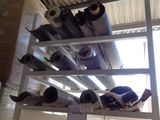 a rack with many different types of pipes on it