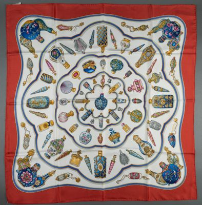 an image of a square scarf with various items on it