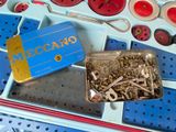 a box with a bunch of screws and nuts in it