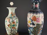 two vases sitting next to each other on a table