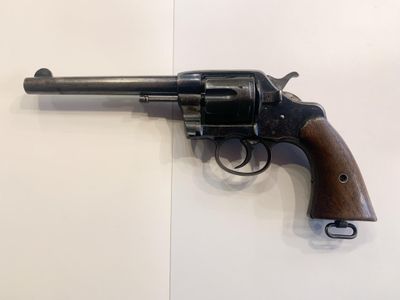 a close up of a revolver on a wall with a white background