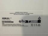 the back of a white laptop with a black and white sticker on it