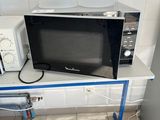 a microwave and a microwave oven sitting on a table