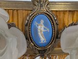 a gold frame with a blue and white picture on it