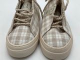a close up of a pair of shoes on a white surface