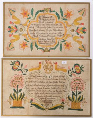 two framed paintings of flowers and birds on a beige background