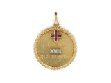 a close up of a gold medal with a cross on it