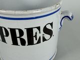 a white and blue pot with the word press written on it