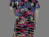 an image of a mannequin wearing a dress with flowers on it