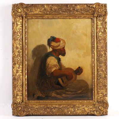 a painting of a man in a turban sitting on the ground
