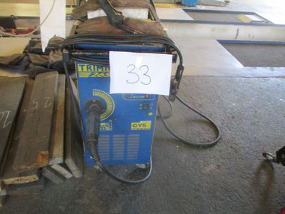 an image of a welding machine in a garage